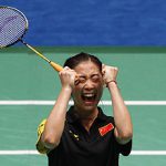 China’s Wang Shixian celebrates her win over compatriot Wang Xin during the badminton women’s singles final at the 16th Asian Games in Guangzhou